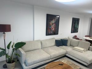 a living room with a couch and a table at Luxury La Cala de Mijas Sunset in Mijas Costa