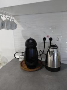a tea kettle on a counter with a tea pot at Corvera Guss in Corvera