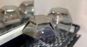 two pieces of metal sitting on top of a keyboard at Goodrich Hotel in Hong Kong