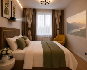 a bedroom with a large bed and a window at Elim-Ai in Kokshetau +2 photos