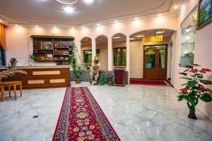 a lobby with a dog standing in the center of a building at Nairi Hotel in Jermuk +72 photos