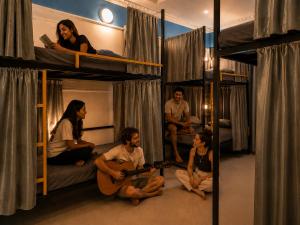 a group of people sitting in bunk beds at Hope Hostels, Fort Kochi in Fort Kochi