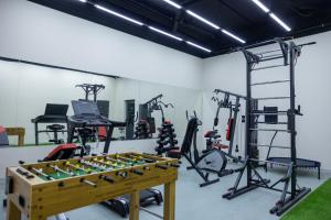 a gym with a foos ball and exercise equipment at Lavanda hotel Tashkent in Tashkent