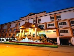 a large building with a fountain in front of it at Phuthong Place in Phayao