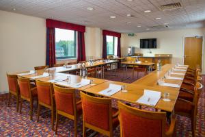 a large dining room with tables and chairs at Holiday Inn Express Bradford City Centre by IHG in Bradford
