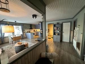 a large room with a kitchen and a living room at Fishermans luck in Arvidsjaur