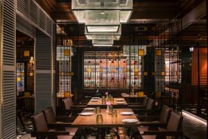 a dining room with a long table and chairs at 10 Park Street Hotel & Banquets in Gorakhpur