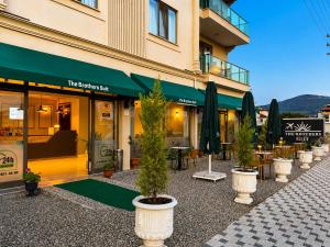 a row of potted plants in front of a building at The Brothers Suite Dalaman in Dalaman