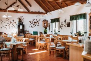 a dining room with tables and chairs at Weingut Pugl in Leibnitz