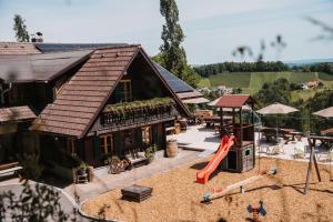 a model of a house with a playground at Weingut Pugl in Leibnitz