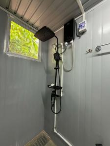 a shower in a small bathroom with a shower at TAGBALAYON-GARDEN Guest House in Siquijor +96 photos