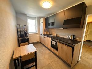 a kitchen with a sink and a counter top at Ferienwohnung EG in Gräfenhainichen