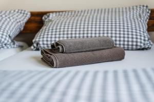 a stack of towels sitting on top of a bed at Seelenruhe in Goch