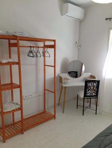 a room with a bunk bed and a desk at DAR Essaad in Wadhraf