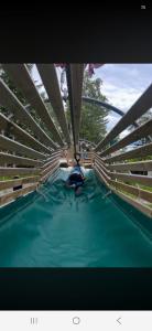 a person laying on top of a swimming pool at Apartament in Sykkylven