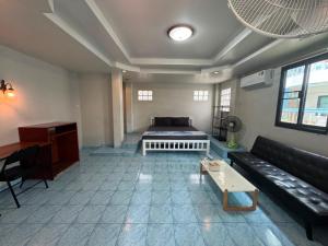 a living room with a bed and a couch at Tommy Apartment - main road in Ko Tao +113 photos