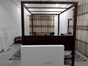 an office with a desk and a mirror in a room at Villa Marina Hikkaduwa in Hikkaduwa