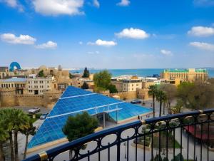 a view of a city with a solar roof at Grand Liman Hotel in Baku