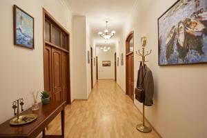 a corridor of a hallway with a long hallway at Grand Liman Hotel in Baku