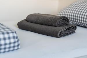 a stack of towels sitting on a counter in a bathroom at Seepark Goch-Kessel in Kessel