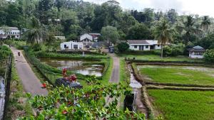 a view of a village with a river and houses at Gal Bungalow in Elpitiya