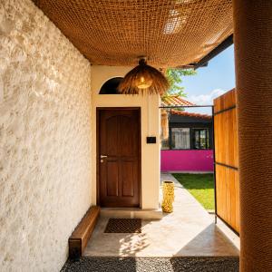 a entrance to a house with a wooden door at 87 Ahangama in Ahangama