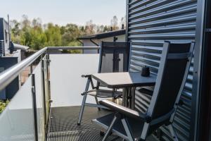 a table and two chairs on a balcony at Lebensfreude in Goch