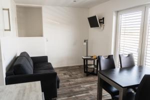 a living room with a couch and a table at Lebensfreude in Goch