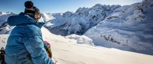 two people standing on top of a snow covered mountain at Maison des Templiers in Luz-Saint-Sauveur