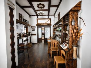 a living room with wooden floors and a ceiling at Vidra Dacica in Vidra