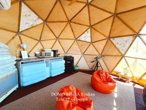 an interior view of a yurt with a kitchen in it at Mirador de Pideago in Bolea