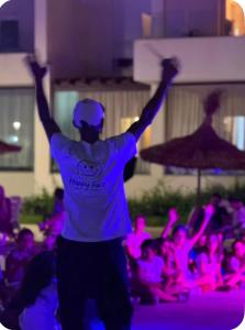 a man standing in front of a crowd of people at Appartement suite in Cabo Negro +34 photos