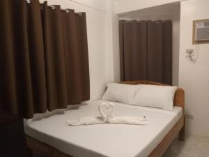 Postel nebo postele na pokoji v ubytování Zenith Inn & Resto Bar