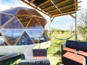 a gazebo with a table and chairs in a field at Mirador de Pideago in Bolea