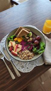a plate of food on a table with a salad and bread at The Edge Villa & Retreat in Pokhara +16 photos