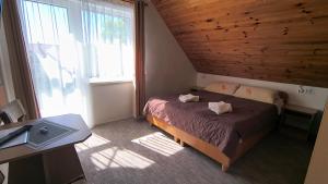a small bedroom with a bed and a window at DW FALA in Rewal