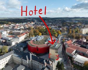 a building in a city with the word hotel at Hotel Aréna in Jihlava
