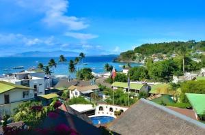 an aerial view of a town and the ocean at Steps Garden Resort in Sabang