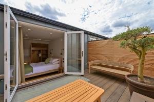 a room with a bed and a sliding glass door at Leworth Apartments, Windsor in Windsor
