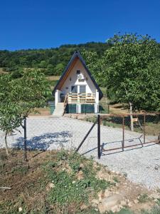 a house with a fence in front of it at Lajlas home in Orašac