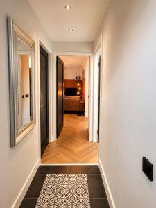 a hallway leading to a bedroom in a house at Cozy apartment in authentic farmhouse in Gouda