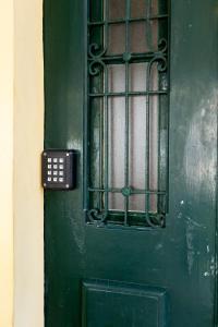 a green door with a window on it at Sleep in Centre - Old Town in Aveiro