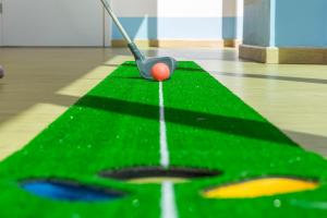 a golf course with a ball on a green field at Laguna - Vilamoura in Vilamoura