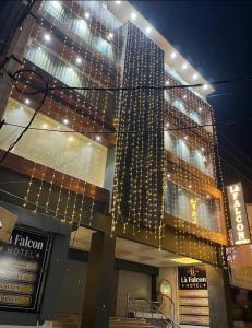 a building with a lot of christmas lights on it at La Falcon Hotel in Rohtak