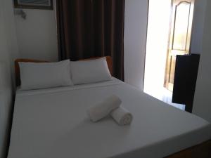 Postel nebo postele na pokoji v ubytování Zenith Inn & Resto Bar