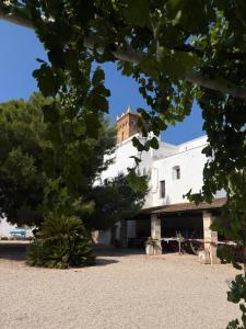 a building with a tower on top of it at Masseria Incantalupi in San Vito dei Normanni