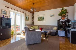 a living room with a couch and a table at Apartment Lise in Dubrovnik