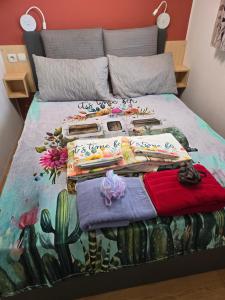 a bed with a painting of a car in the ocean at Iscles 231- MH Au calme près du lac in La Roque-dʼAnthéron +51 photos