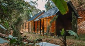 a wooden house in the middle of a forest at LOUVREFER in Ban Pa Pae