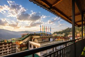 a view of a city from a balcony at Sparrow Elements Boutique 2 min walk To Mg Marg in Gangtok